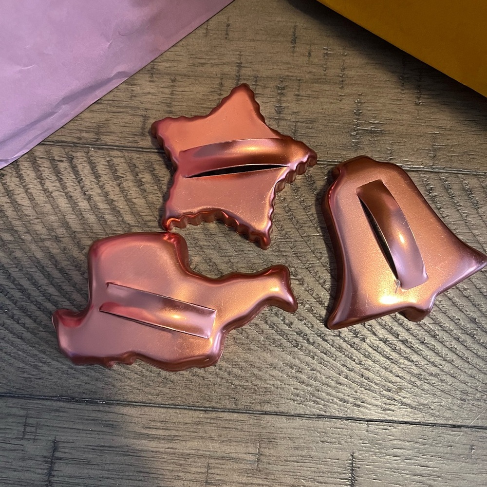 a set of three vintage copper cookie cutters